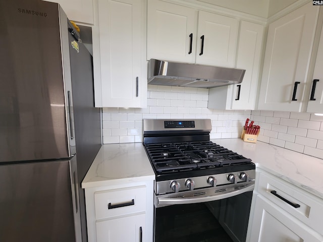 kitchen featuring exhaust hood, white cabinetry, stainless steel appliances, and decorative backsplash