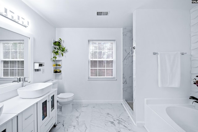 full bathroom with separate shower and tub, vanity, and toilet