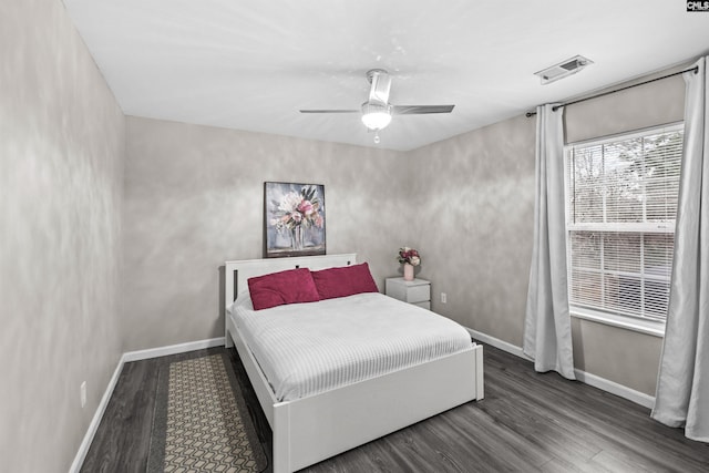 bedroom with ceiling fan and wood-type flooring