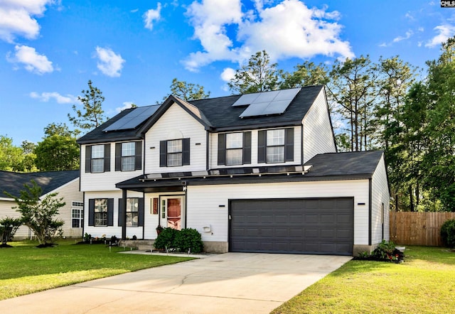 view of front of home with a garage, a front yard, and solar panels