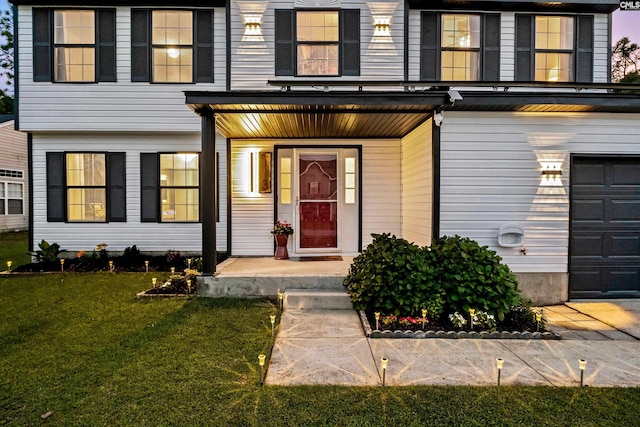 property entrance with a porch and a yard