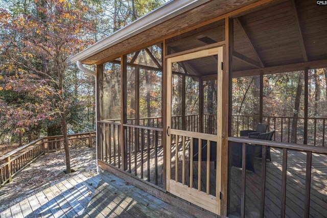 deck with a sunroom