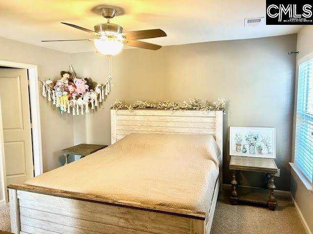 carpeted bedroom featuring ceiling fan