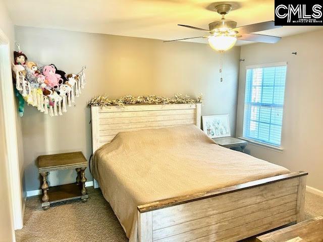 carpeted bedroom featuring ceiling fan