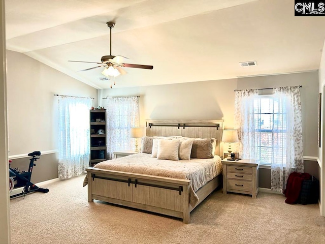 carpeted bedroom featuring ceiling fan and vaulted ceiling