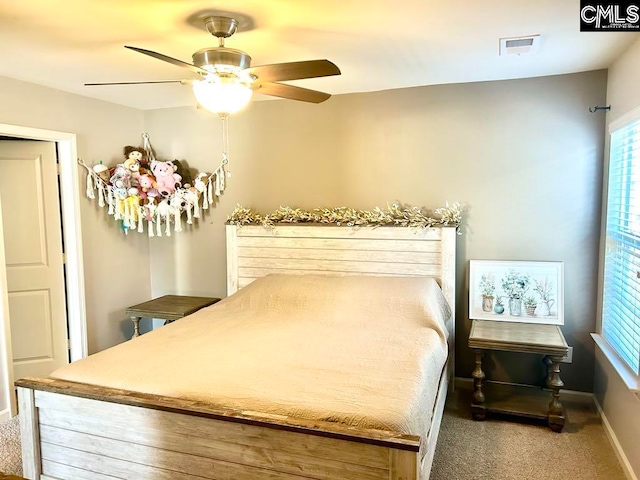 bedroom with ceiling fan and carpet floors