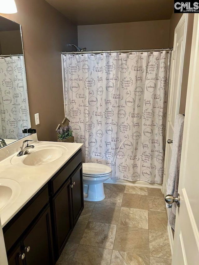 full bathroom with vanity, toilet, and shower / bath combo