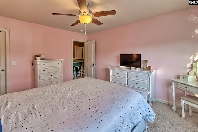 bedroom with ceiling fan and light colored carpet