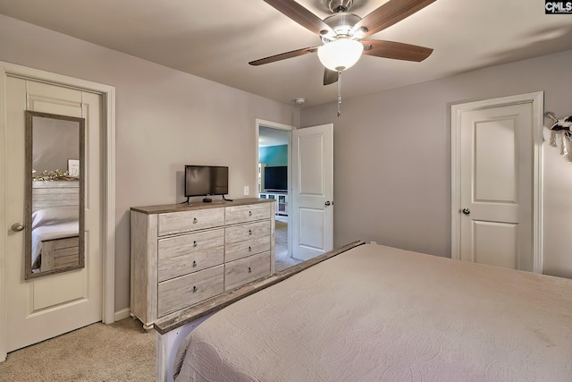 bedroom featuring light colored carpet and ceiling fan