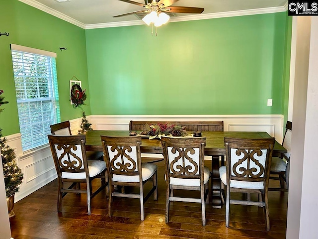 dining area with dark hardwood / wood-style floors, ceiling fan, and ornamental molding