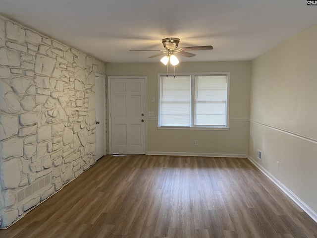 empty room featuring hardwood / wood-style floors and ceiling fan