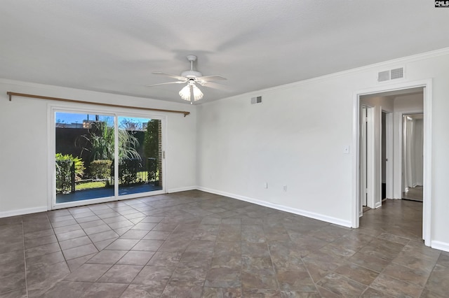 unfurnished room featuring ceiling fan, a textured ceiling, and ornamental molding