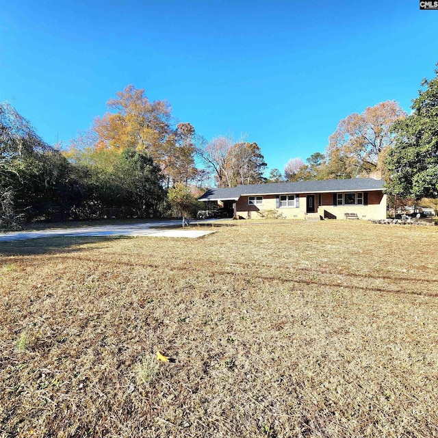 exterior space with a front lawn