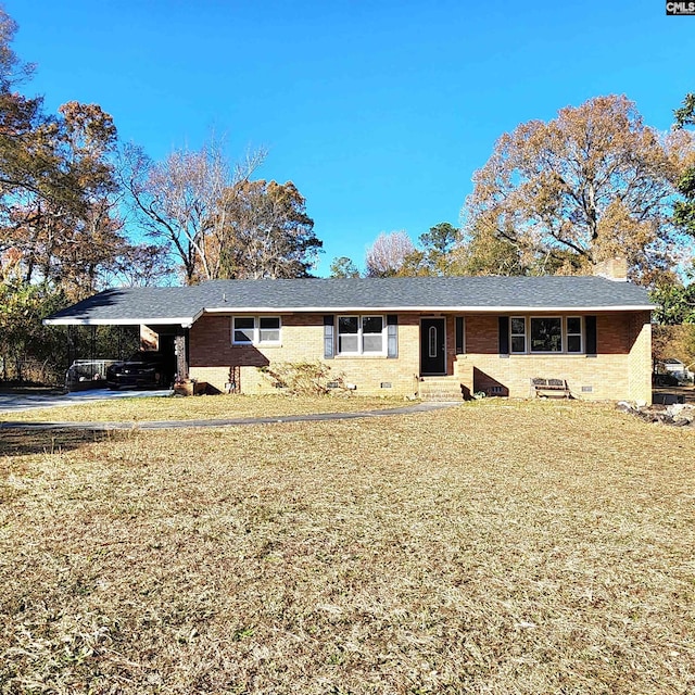 single story home featuring a front yard and a carport