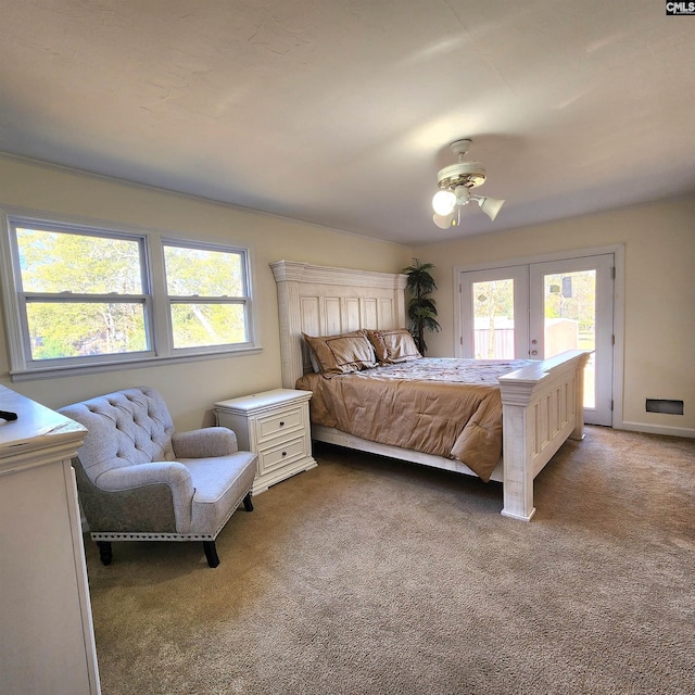 bedroom with carpet flooring, multiple windows, and ceiling fan