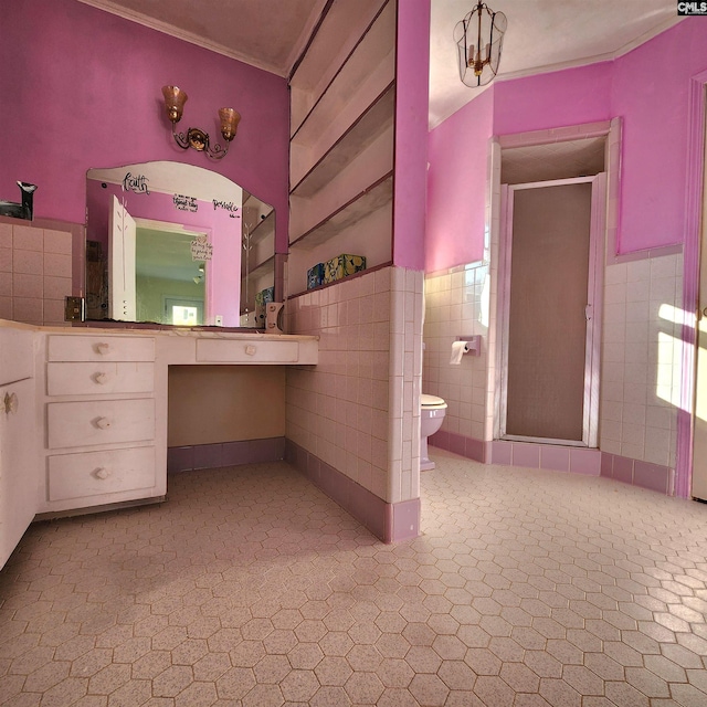 bathroom with toilet, a shower with door, and tile walls