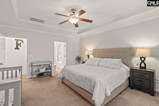 bedroom with light carpet, ensuite bathroom, ceiling fan, and crown molding