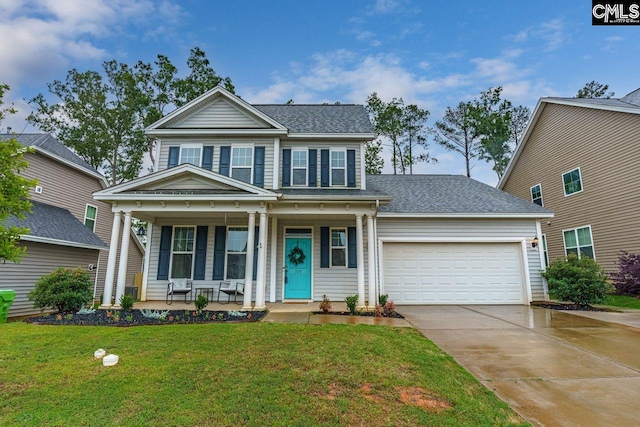 view of front of property with a front yard, a porch, and a garage