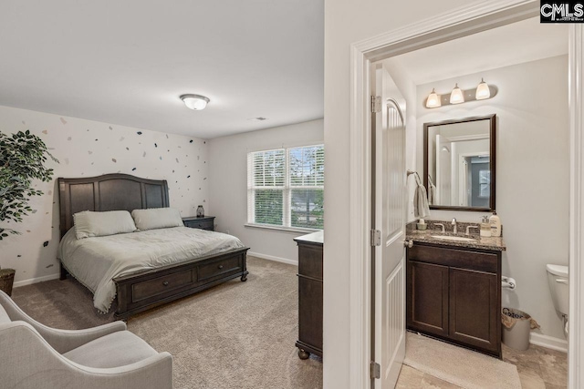 carpeted bedroom with sink