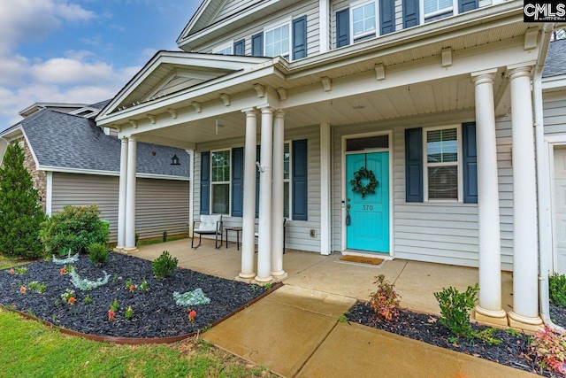 doorway to property featuring a porch