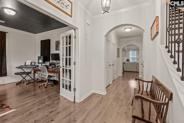 entrance foyer with light hardwood / wood-style floors and ornamental molding