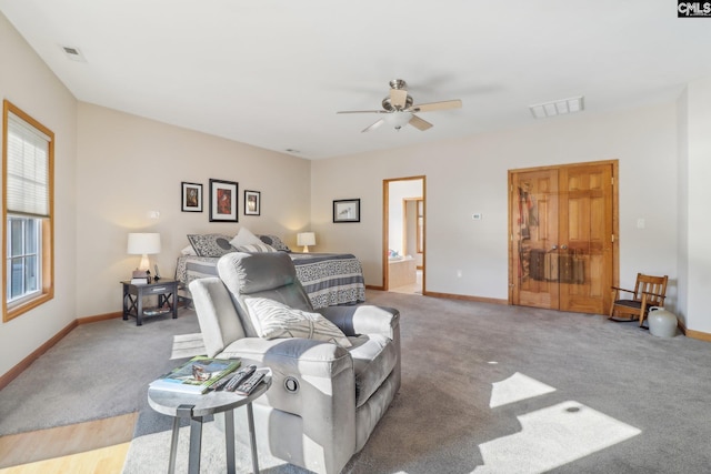 living room featuring carpet and ceiling fan