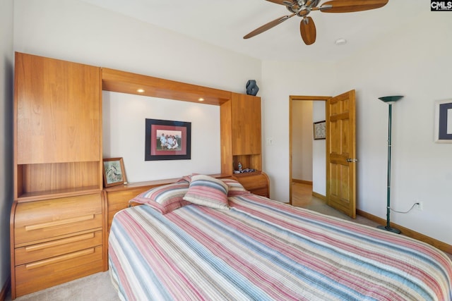 bedroom with ceiling fan and light colored carpet