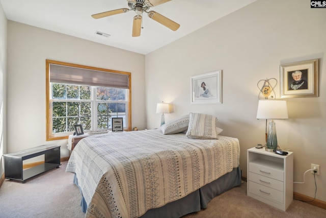 bedroom with light colored carpet and ceiling fan