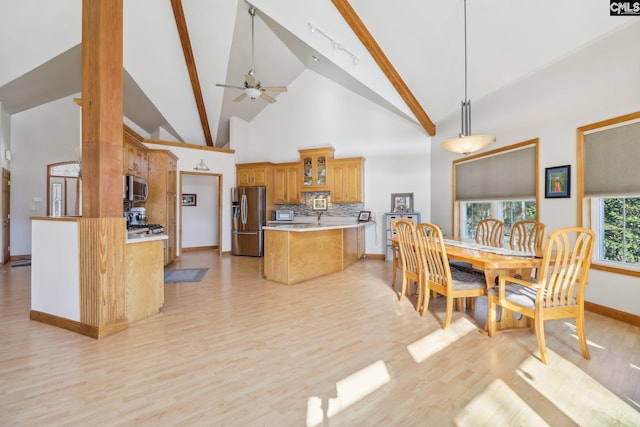 dining room with beamed ceiling, ceiling fan, high vaulted ceiling, and light hardwood / wood-style flooring