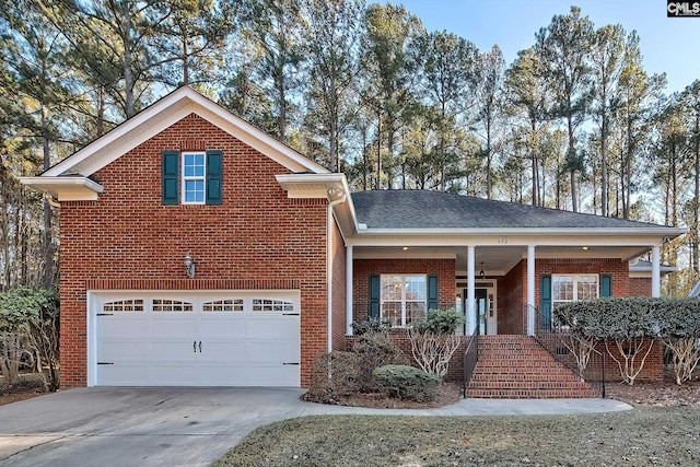 front of property featuring covered porch and a garage