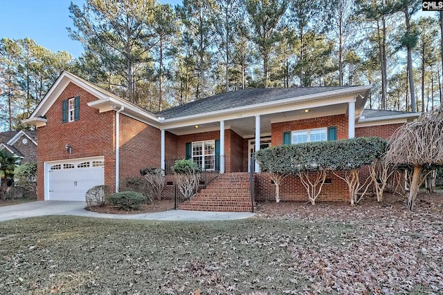 view of front facade with a porch and a garage