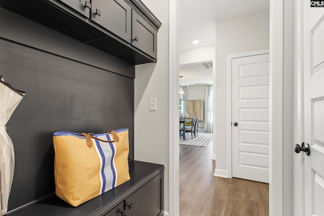 interior space with recessed lighting, baseboards, and wood finished floors