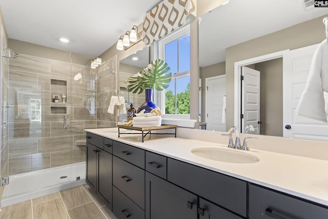 full bath with recessed lighting, visible vents, a shower stall, and vanity