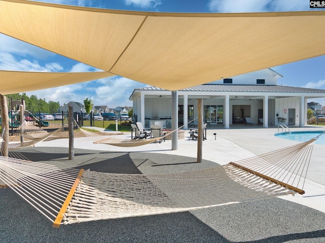 exterior space with ceiling fan, a patio area, and fence