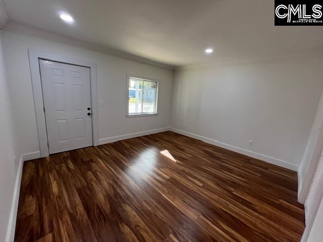 entrance foyer with dark hardwood / wood-style flooring