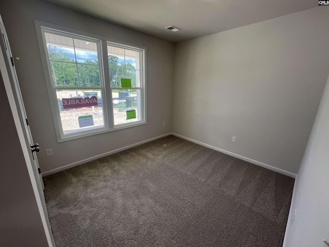 empty room with carpet flooring