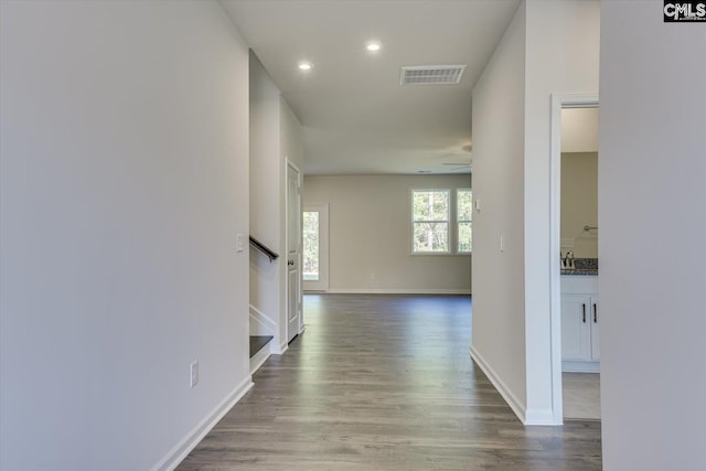 hallway featuring wood-type flooring