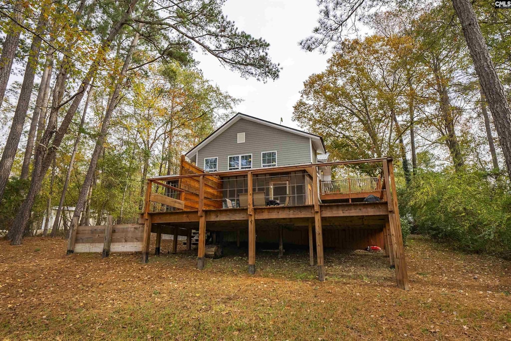 rear view of house featuring a deck