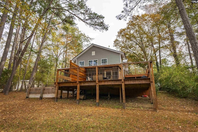 rear view of house featuring a deck