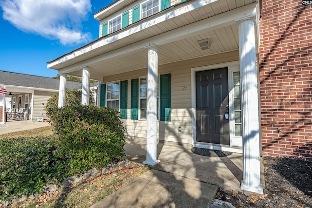 doorway to property with a porch