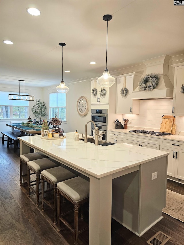 235 Clayborn Dr, Lexington, SC 29072 - kitchen featuring dark hardwood / wood-style floors, a spacious island, a wealth of natural light, and gas cooktop