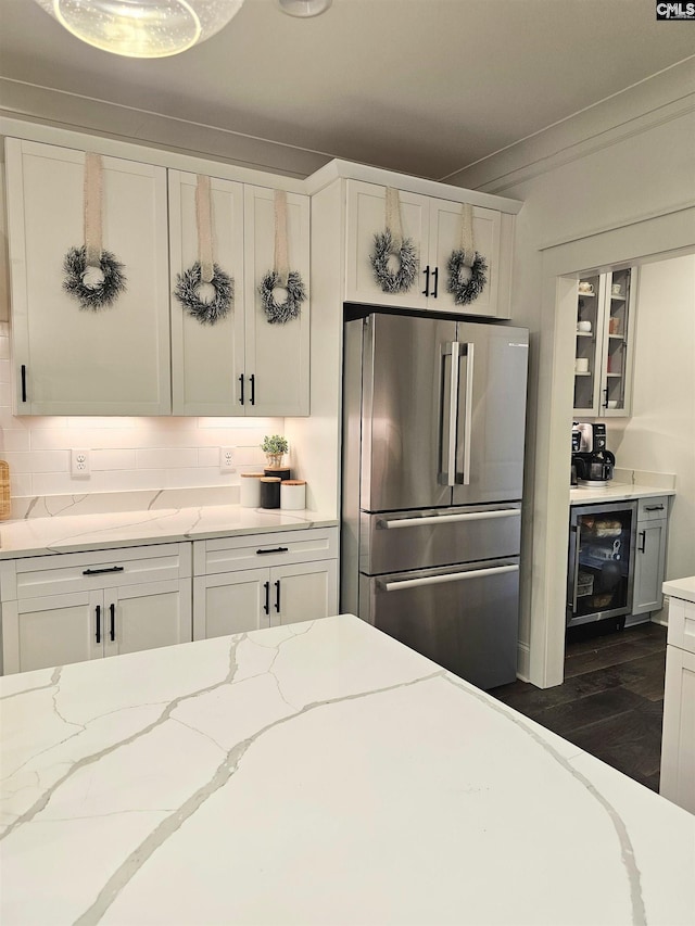 235 Clayborn Dr, Lexington, SC 29072 - kitchen with white cabinetry, light stone countertops, dark wood-type flooring, beverage cooler, and stainless steel fridge