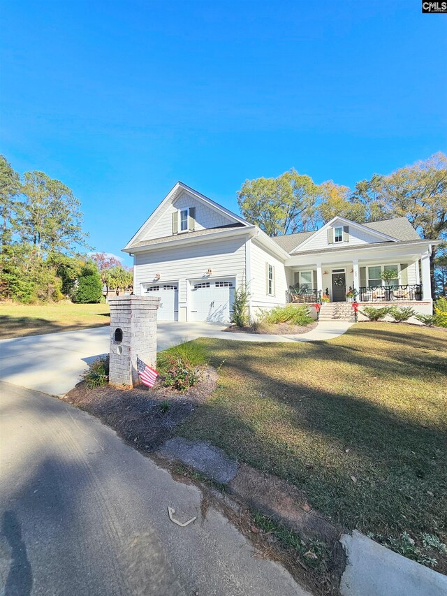 235 Clayborn Dr, Lexington, SC 29072 - view of front of house featuring a front yard, a porch, and a garage