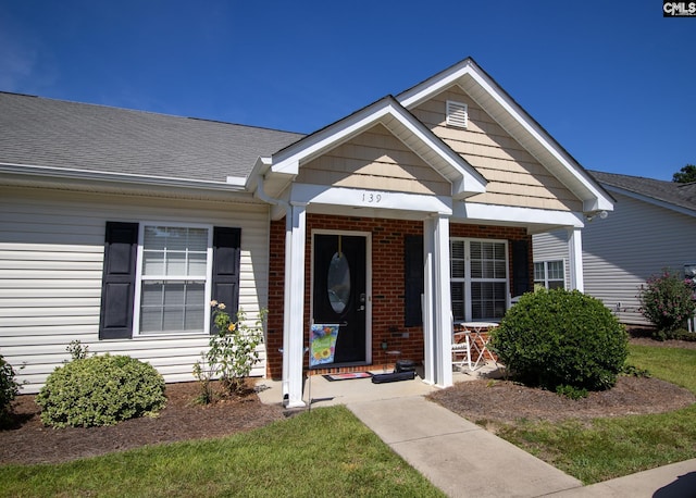 entrance to property featuring covered porch