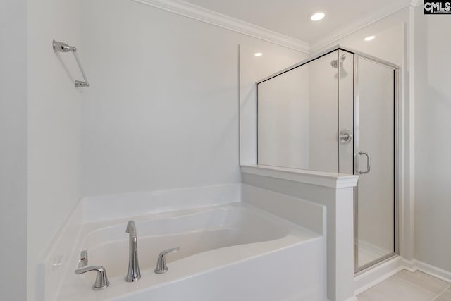 bathroom featuring tile patterned flooring, shower with separate bathtub, and ornamental molding