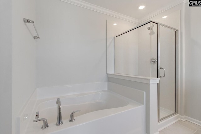 full bath featuring a stall shower, ornamental molding, a garden tub, tile patterned flooring, and recessed lighting