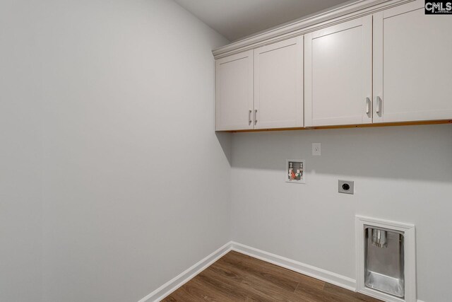 laundry room with cabinet space, baseboards, dark wood-style floors, hookup for a washing machine, and hookup for an electric dryer