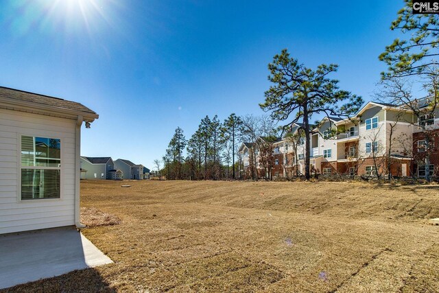 view of yard featuring a residential view