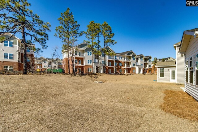 view of yard featuring a residential view