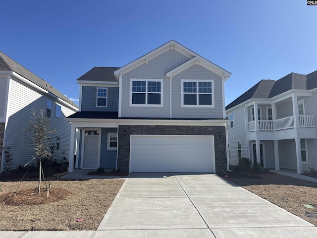 view of front facade with a garage, concrete driveway, and board and batten siding